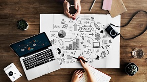 Simplify your online business tech - planning meeting with large notepad